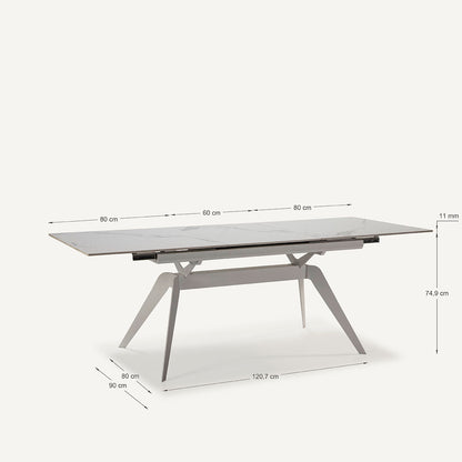 Mesa comedor Lula, rectangular y extensible, en color blanco con pie metálico blanco. Fabricada de cerámica y metal.