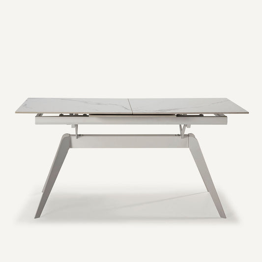 Mesa comedor rectangular y extensible, en color blanco con pie metálico blanco. Fabricada de cerámica y metal.