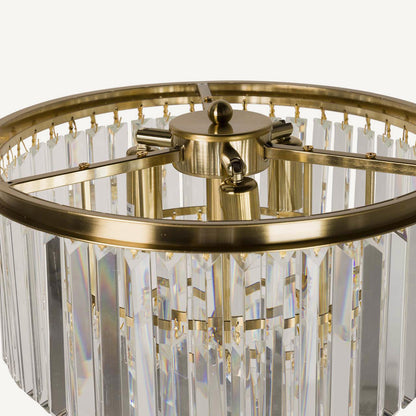 Lámpara de pie de cristal con láminas en color dorado
