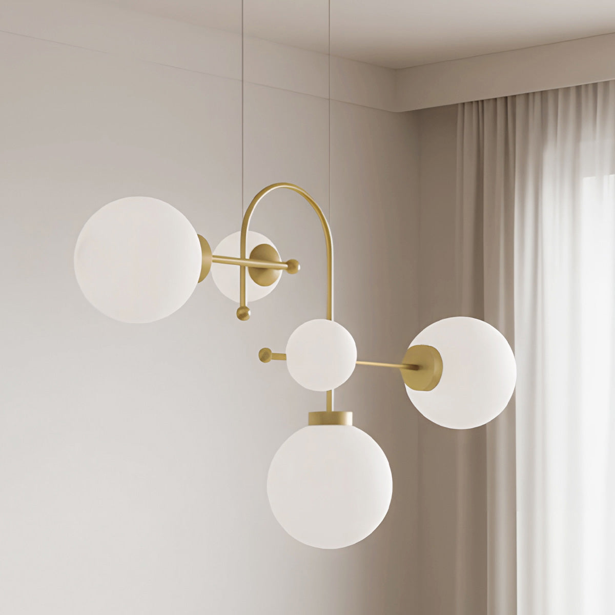 Lámpara de techo con 5 esferas  redondas en blanco negro en distintas alturas y tamaños
