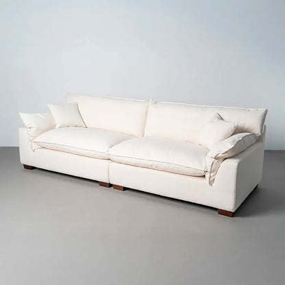 Sofá 4 plazas en color crema, de madera y tejido de lino