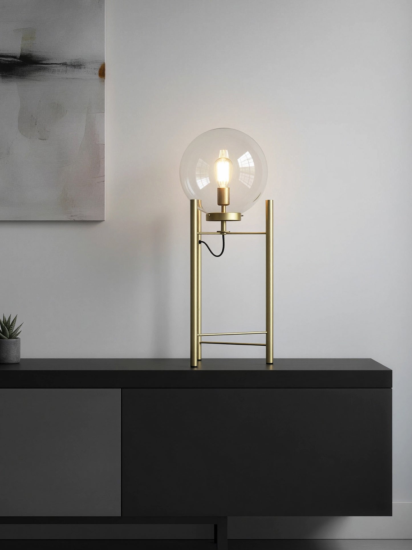 Lámpara de mesa de acero dorado con esfera de cristal transparente