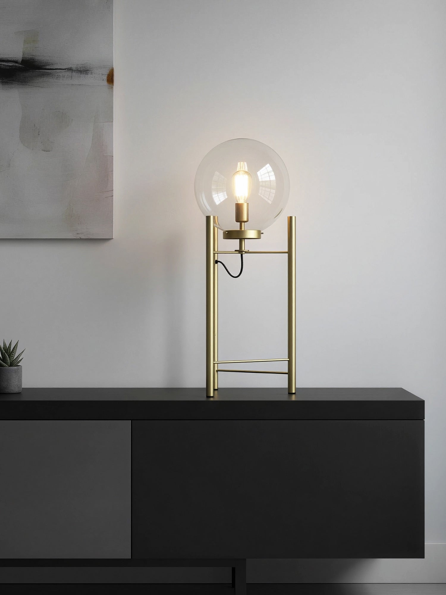 Lámpara de mesa de acero dorado con esfera de cristal transparente