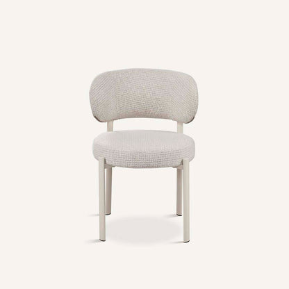 Silla para el salón o comedor, con asiento tapizado en color gris, respaldo redondeado y patas de metal color blanco.