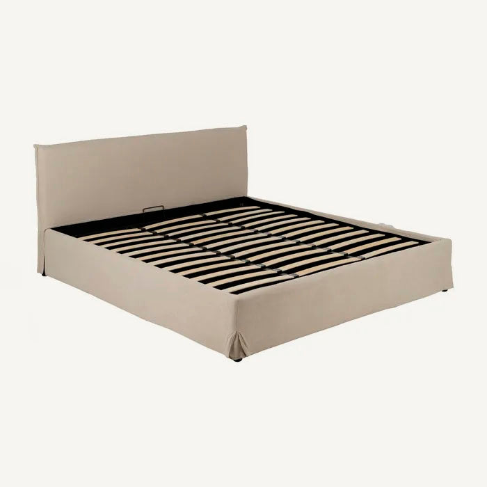 Cama doble tapizada con canapé y cabezal, de textura suave color beige. Apta colchón 180x200 cm