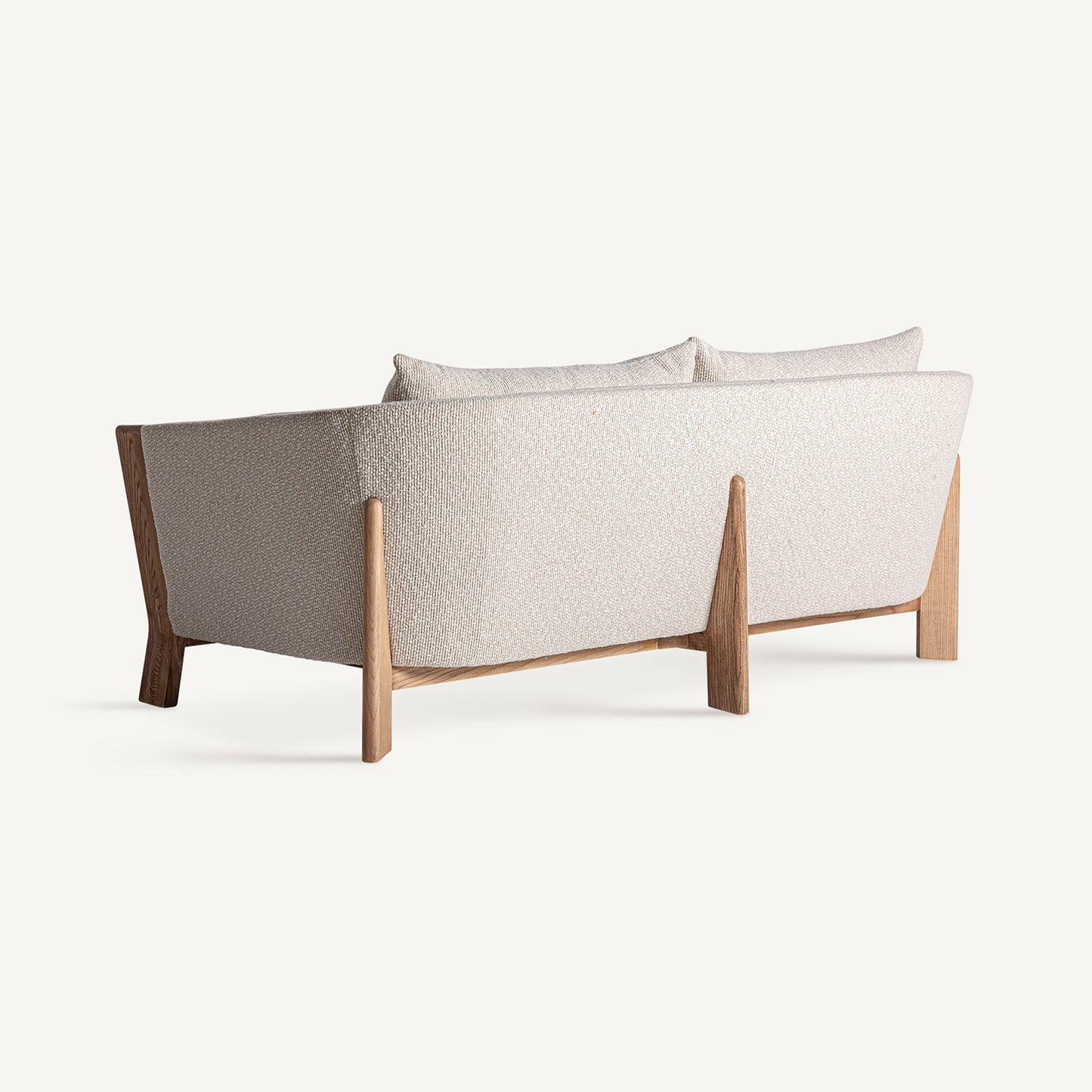 Vista trasera del sofá Nara beige de estilo minimalista.