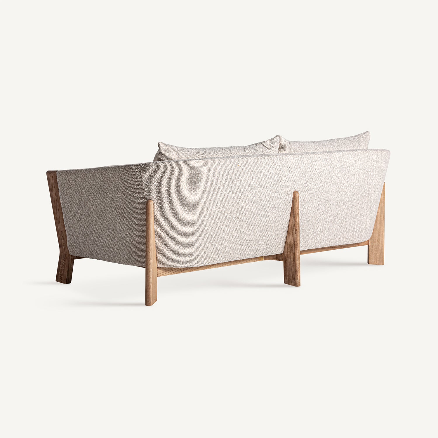 Vista trasera del sofá Nara beige de estilo minimalista.